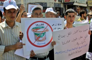 Palestinians demonstrate for a boycott of Israeli goods and support national products during a protest  in the West Bank city of Nablus,on June 9,2012. Photo by Nedal Shtieh
